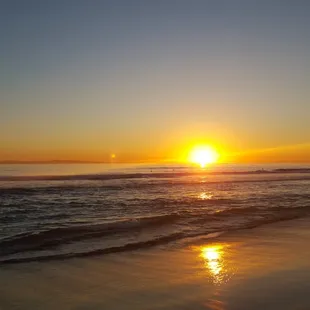 the sun setting over the ocean