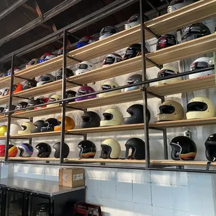 a wall full of helmets