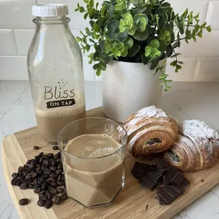 Our Dibs On Nibs spiced cold brew (coffee brewed with cocoa nibs and orange peel) pairs beautifully with our Pain Au Chocolat baking class.