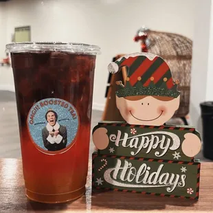 a cup of iced tea and a christmas card
