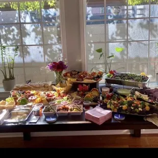 Light charcuterie spread with crudités and power green salads