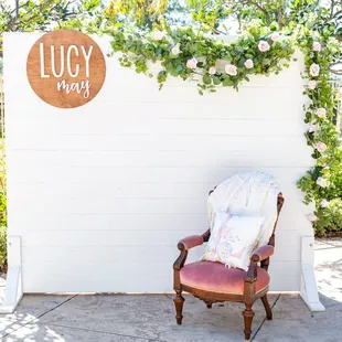 Our basic white wall backdrop creates the picture perfect spot!  Picture courtesy of Bella Jeanne Photography