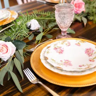 Beautiful vintage table settings by Oh So Pretty Vintage paired with our rustic farm tables.  Photo courtesy of Bella Jeanne Photography