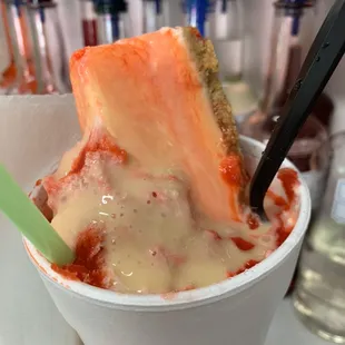 XL Cheesecake stuffed Snoball. Flavor: Strawberry. Comes with a whole slice of cheesecake, condensed milk and seasonal fruit.