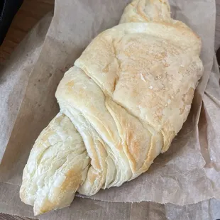 A sad, sad, pale "croissant" that fell out of the oven too soon and was possibly stepped on.