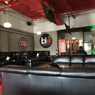 black leather couches and chairs