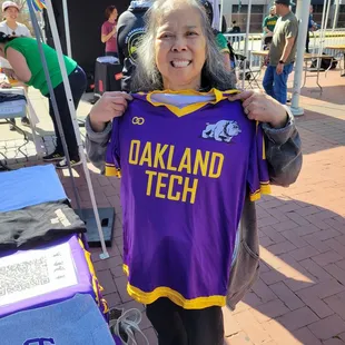 Me posing with a jersey from my school.