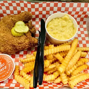 fried chicken, macaroni and cheese fries, pickle and cucumber