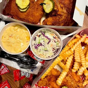 a box of fried chicken, fries, coleslaw, and coleslaw