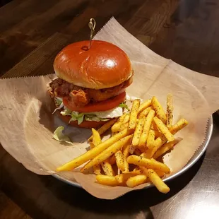 Breaded pork chop sandwich with fries