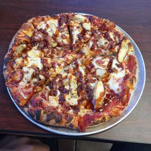 a pizza on a pan on a table