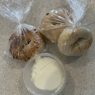 Cream cheese tub with everything, sourdough and apple cinnamon bagels