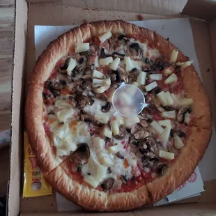 Gluten free pizza with mushrooms and pineapple