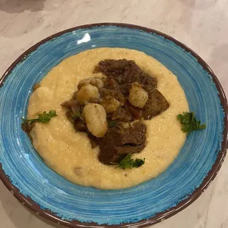 Grandmothers pot roast over cheese grits
