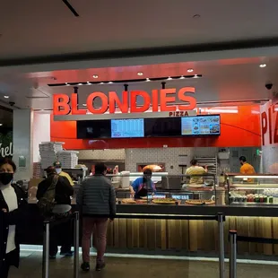 a group of people at a counter