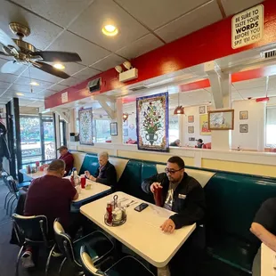 a group of people sitting at a table