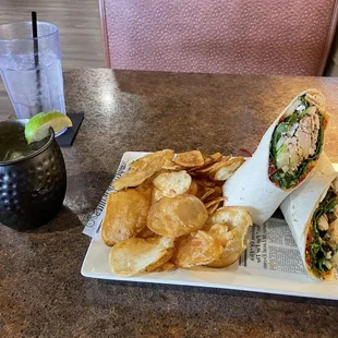 Potato chips, Mediterranean Wrap with roasted red pepper hummus, chicken &amp; a pineapple mule