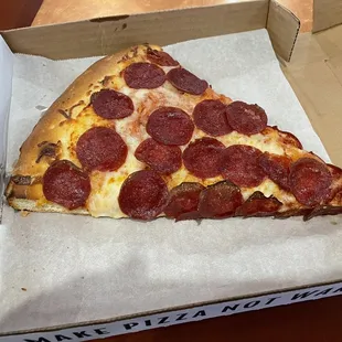 Big slide of pepperoni pizza