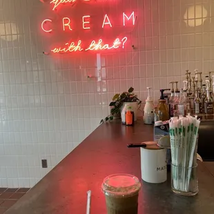 a neon sign that reads, you're around cream with