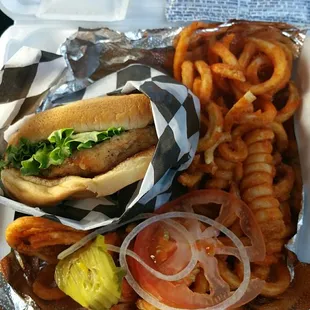 Fried chicken sandwich and curly fries