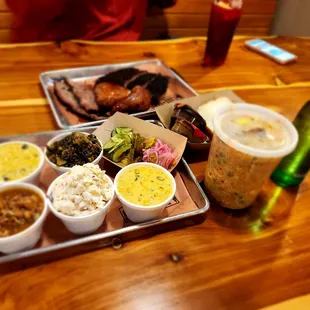 Smoked chicken, brisket, pork ribs, couple creamed corns, cole slaw, pinto beans and collard greens. House made pickles.