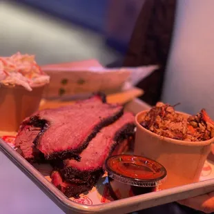 a tray of meat and sides