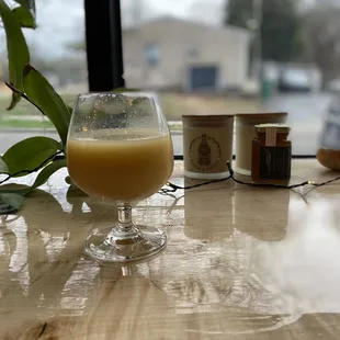 a glass of orange juice on a table