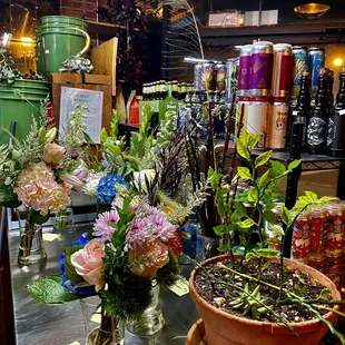 a variety of flowers in vases