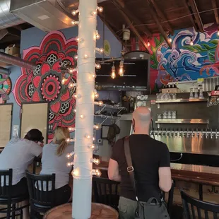 two people sitting at a bar