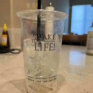 a shake of life cup with a straw