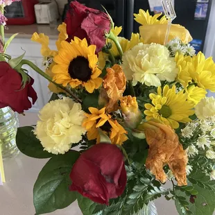 Day 2 Roses never opened. Wilting sunflowers.