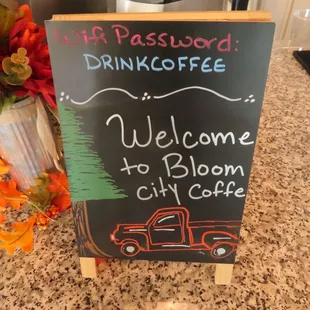 a welcome sign for bloom city coffee