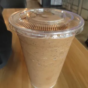 a smoothie in a plastic cup