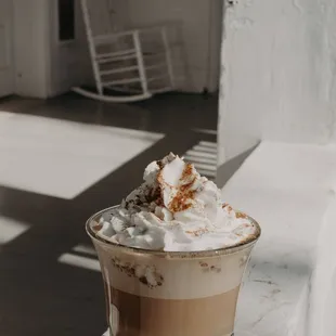 a cup of coffee with whipped cream