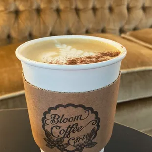 a cup of coffee on a table