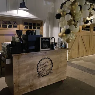 a coffee station with balloons