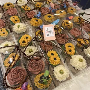 a variety of decorated cupcakes
