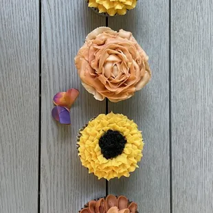 A board with our floral cupcakes in fall colors.