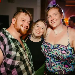 three people posing for a picture