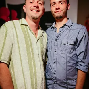 two men standing next to each other