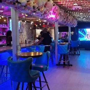 Flower bar, overhead fairy lights and comfortable seating.