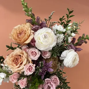 Hand tied bouquets full of novelty roses, ranunculus,  lisianthus, and more!