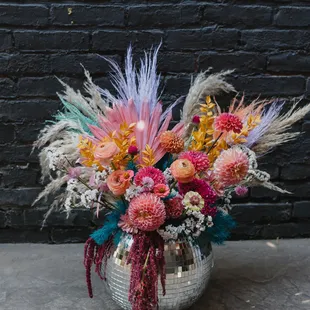 Custom disco ball floral arrangement for a clients birthday!