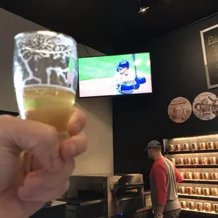 Brewers on tv at this brewery.