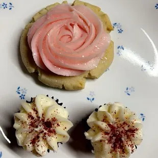 Sugar cookie with regular frosting and mini red velvet cup cakes are to die for