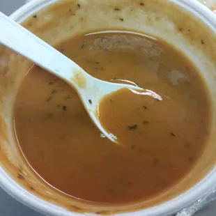 Creamy tomato basil soup. Has a lot of herbs in it. Very flavorful.