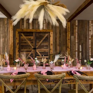 Inside barn at Bloomfield Meadows. Boho reception Dusty Rose