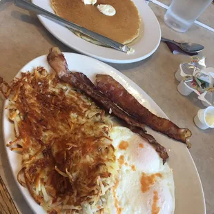 3 over easy bacon crispy hash browns and a fluffy pancake y'all!! #deelish