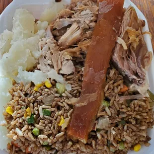Lechon with yucca and Cuban fried rice