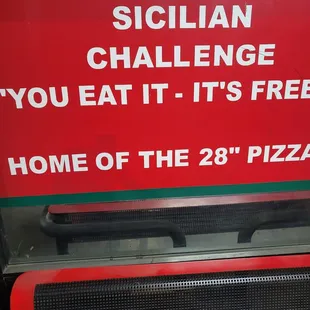 a sign that reads bloomingdale&apos;s sicilian challenge you eat it&apos;s free home of the 23